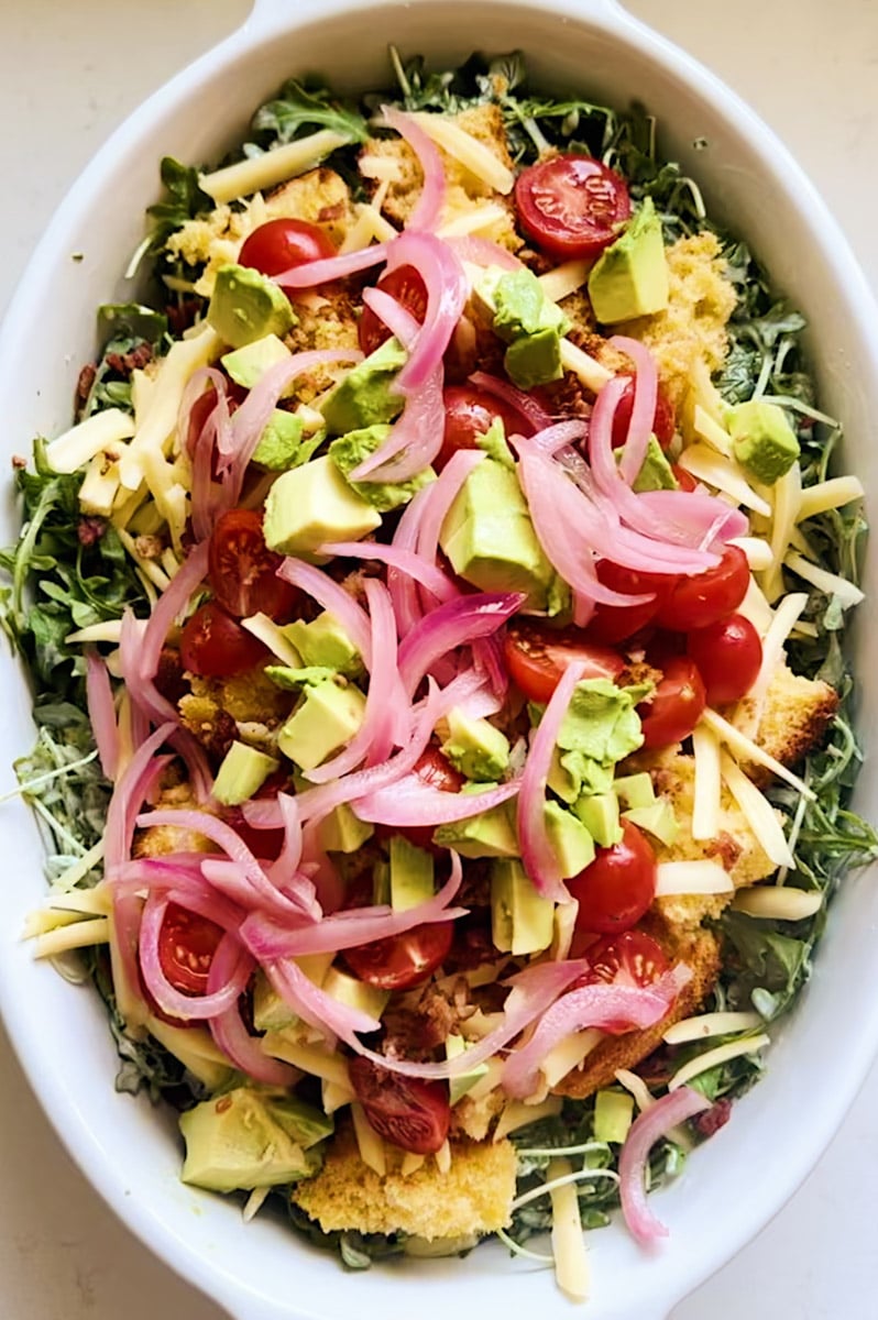 a big batch of cornbread salad in a serving bowl. 