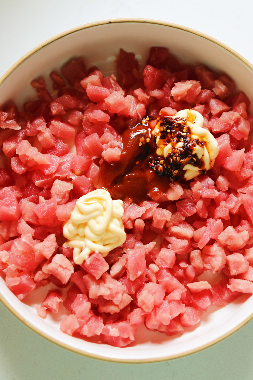 sushi grade tuna diced up with kewpie japanese mayonnaise, sriracha, sesame oil and crispy chili oil.