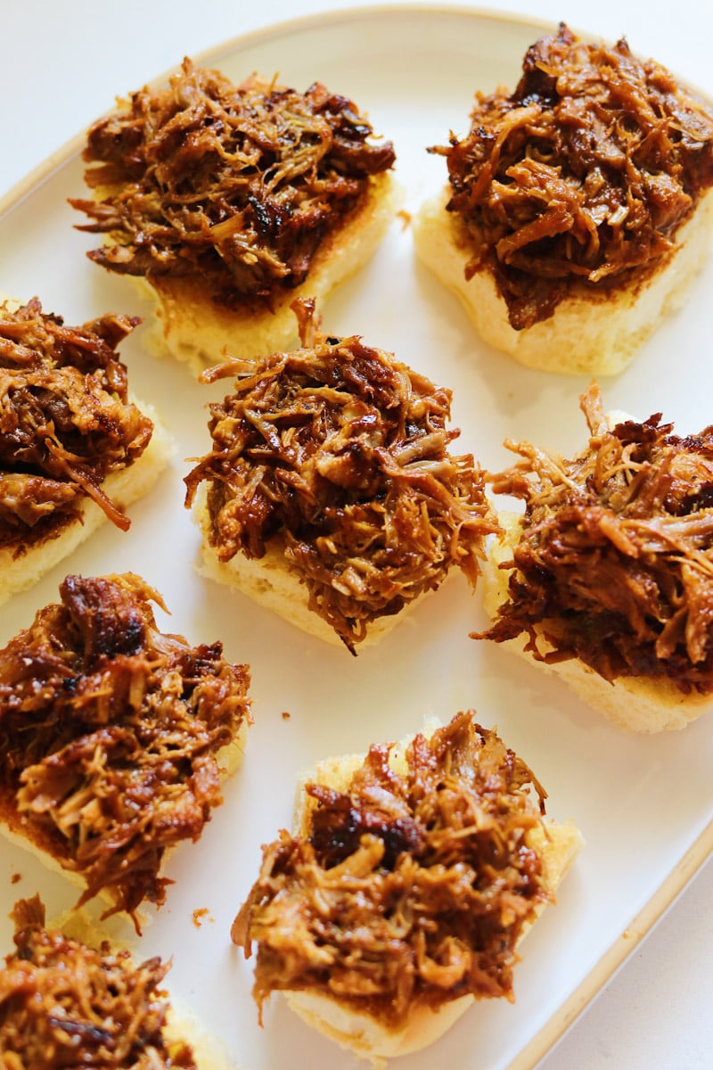 pulled pork on top of toasted slider buns.