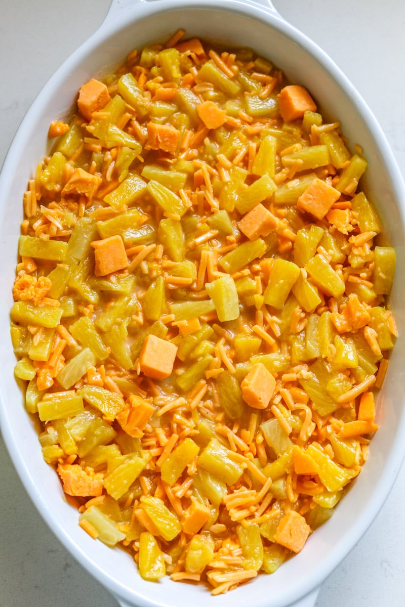 a casserole dish full of cheesy pineapple for casserole. 