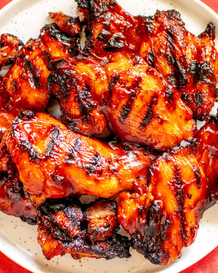 BBQ Chicken Thighs on a white plate.