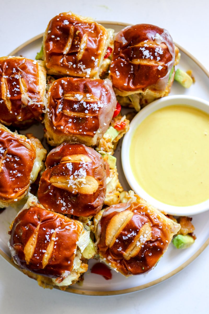 an overhead view of a plate full of crispy chicken sliders. 