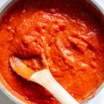 a sauce pan full of bright red southern tomato gravy.
