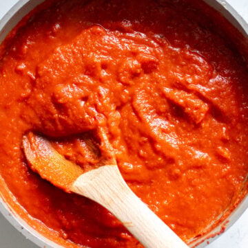 a sauce pan full of bright red southern tomato gravy.