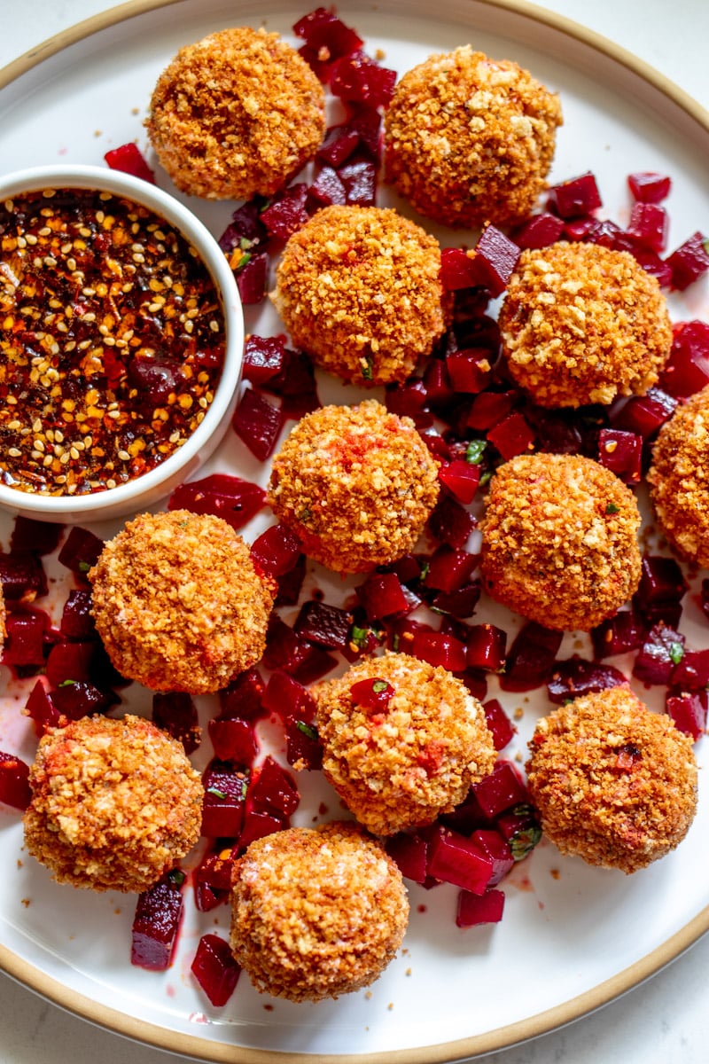 Fried Goat Cheese Balls on a plate with spicy honey