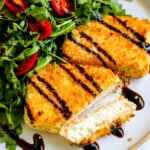 two pieces of fried feta with balsamic drizzle on top.