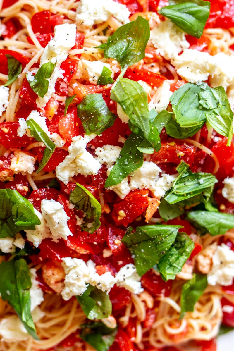 an up close view of the ingredients in bruschetta pasta salad.