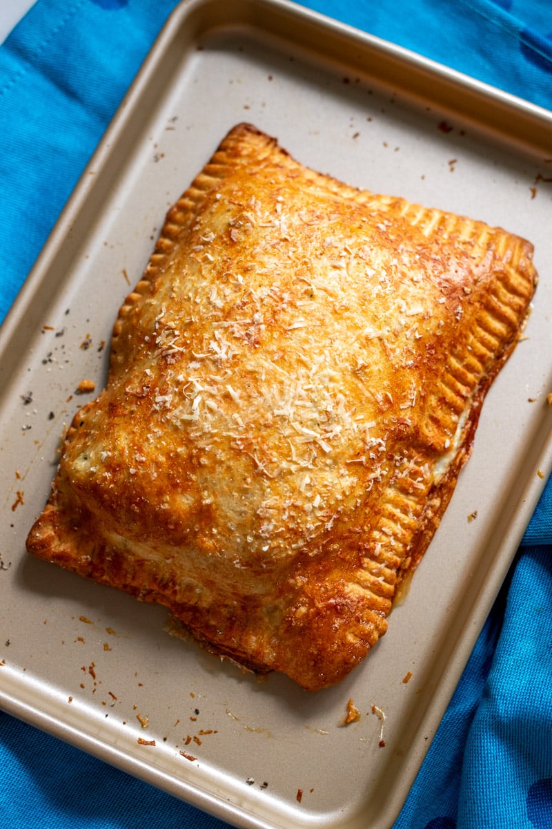 a large homemade hot pocket on a small baking sheet.