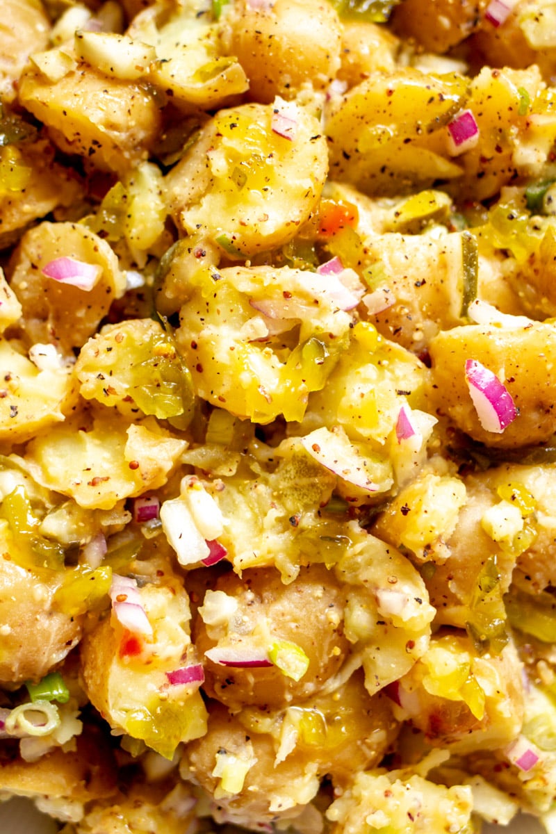 a close up view of the texture of this creamy potato salad.