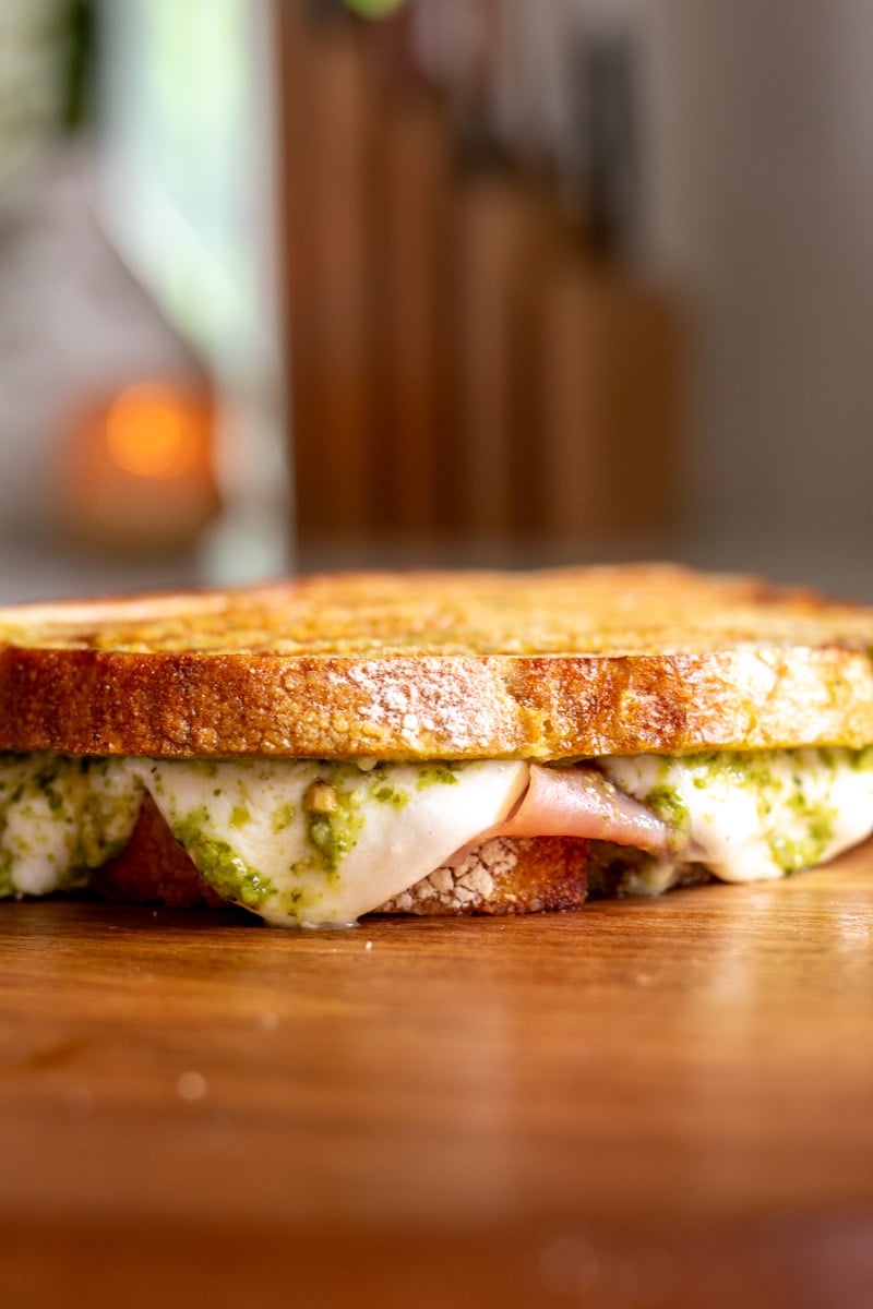 a grilled panini on a cutting board.