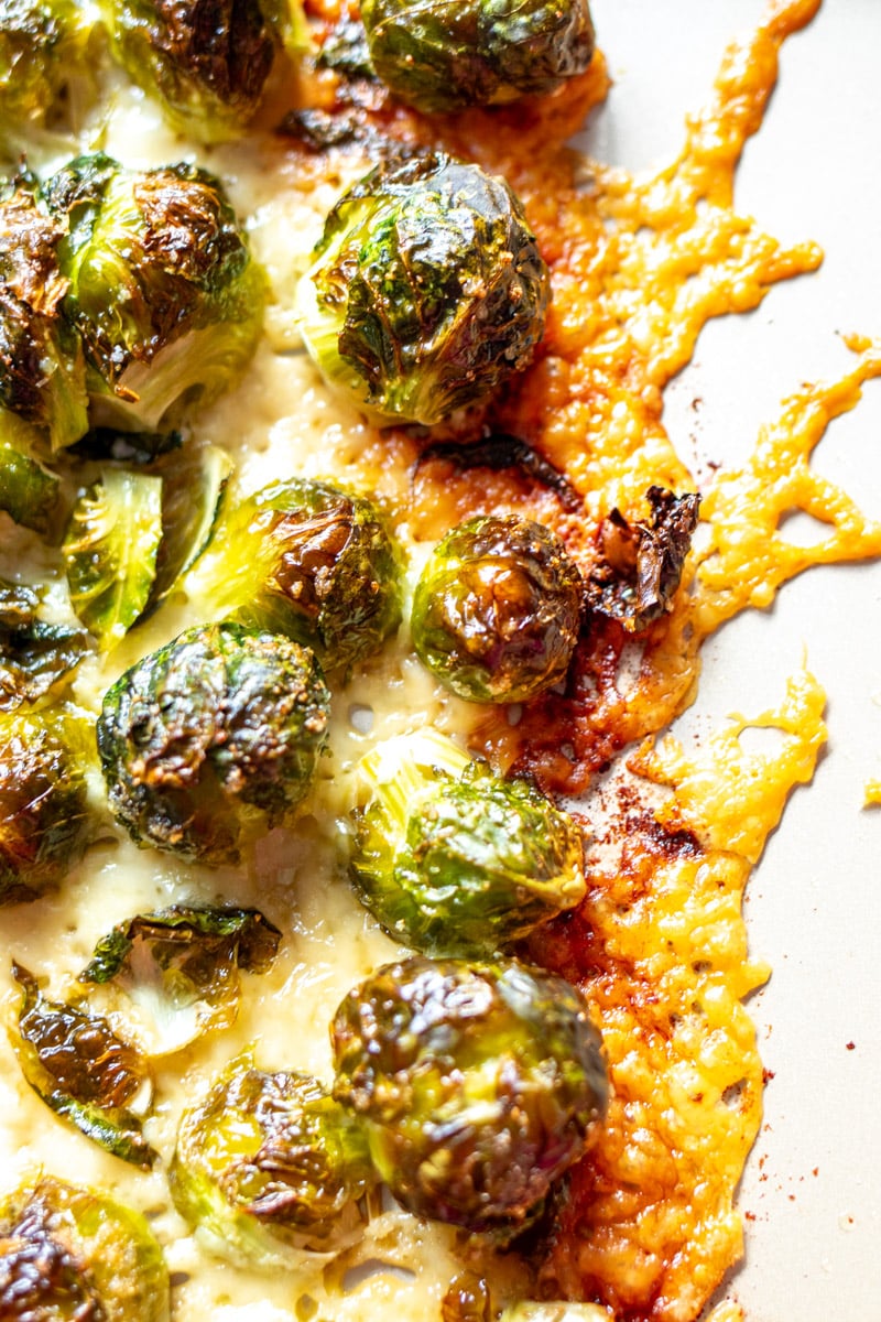 an up close view of the crispy crust of parmesan brussels sprouts.