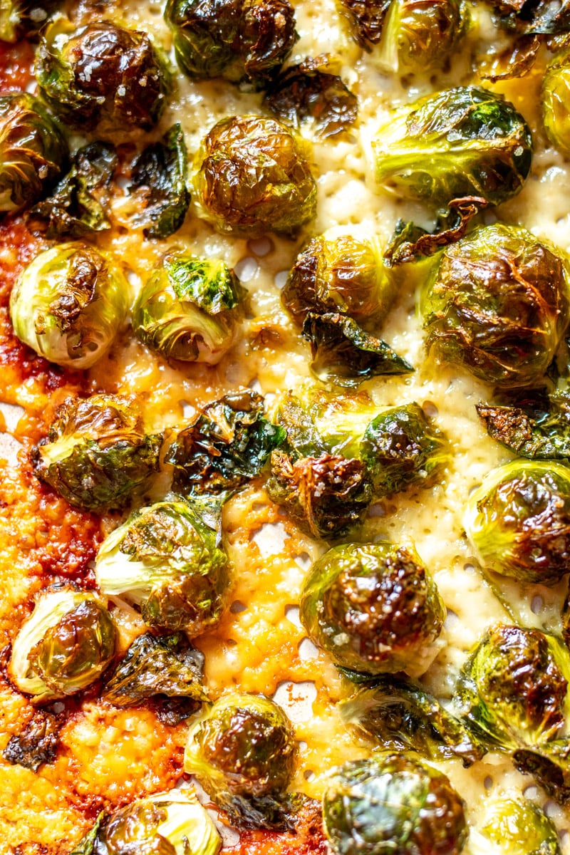 a macro view of parmesan crusted brussels sprouts.