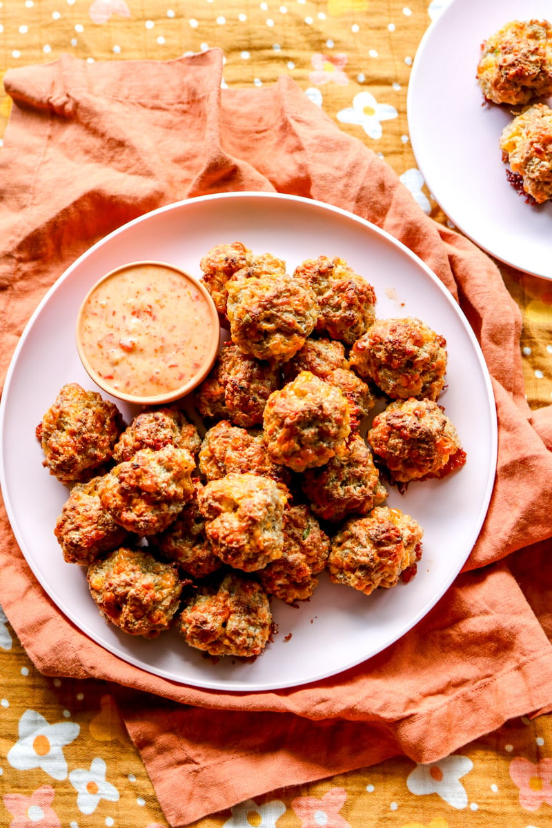 an overhead view of a table filled with a cream cheese sausage ball platter.