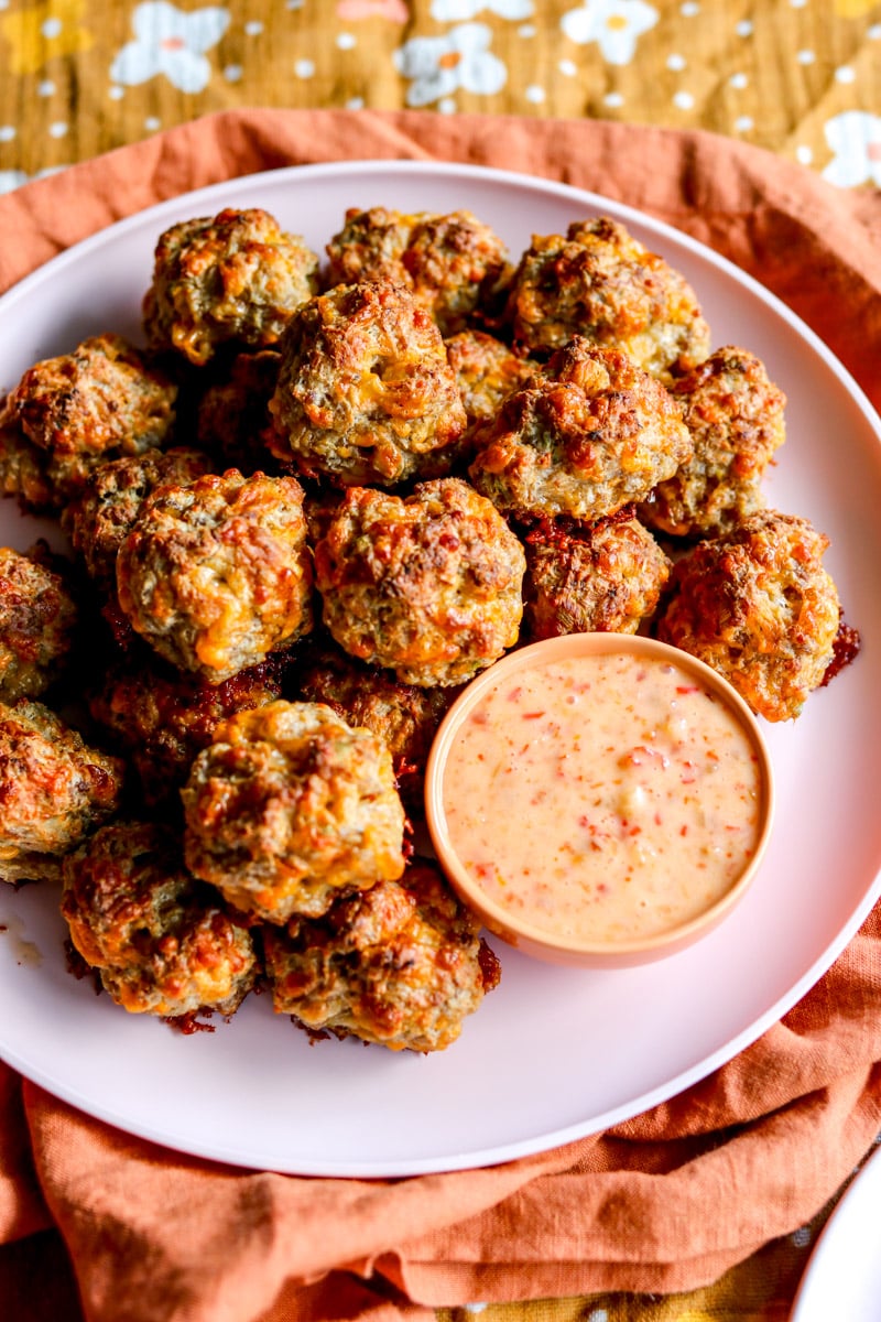 an overhead view of a platter of homemade cream cheese sausage balls.