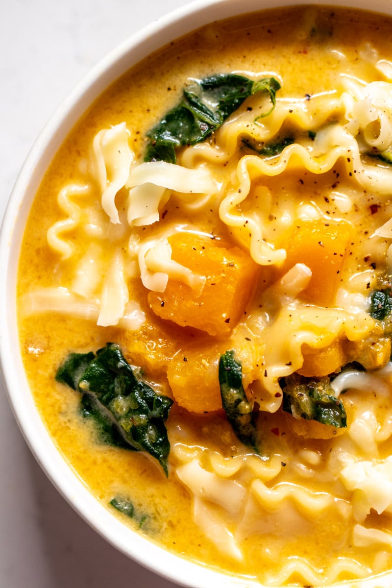 the left side of a bowl of butternut squash lasagna soup.