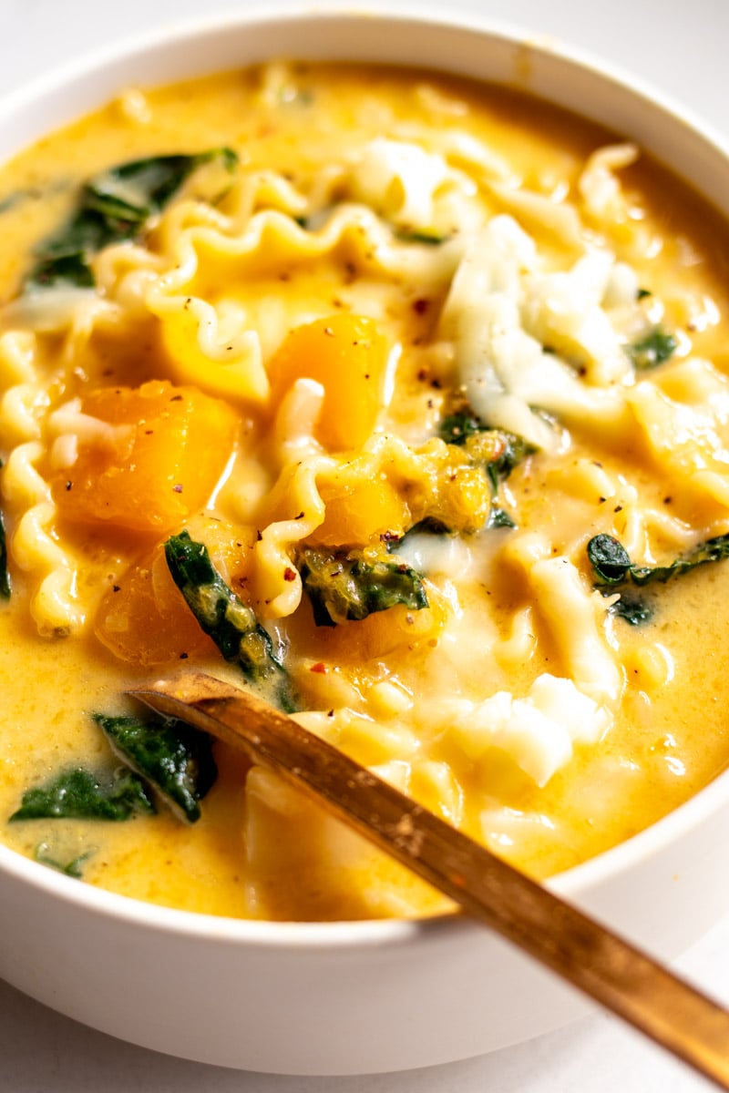 an up close view of a bowl of butternut squash lasanga soup.