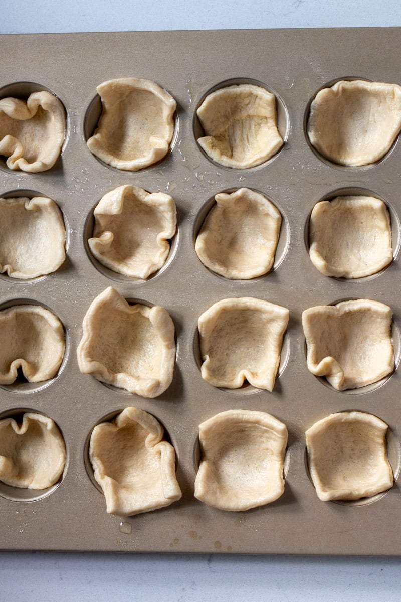 puff pastry dough in a muffin tin. 