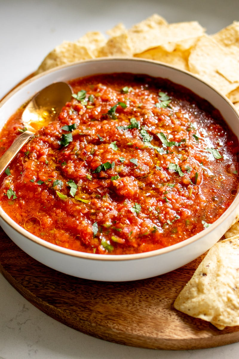 an overhead view of the best fresh hot salsa recipe with chips on the side.