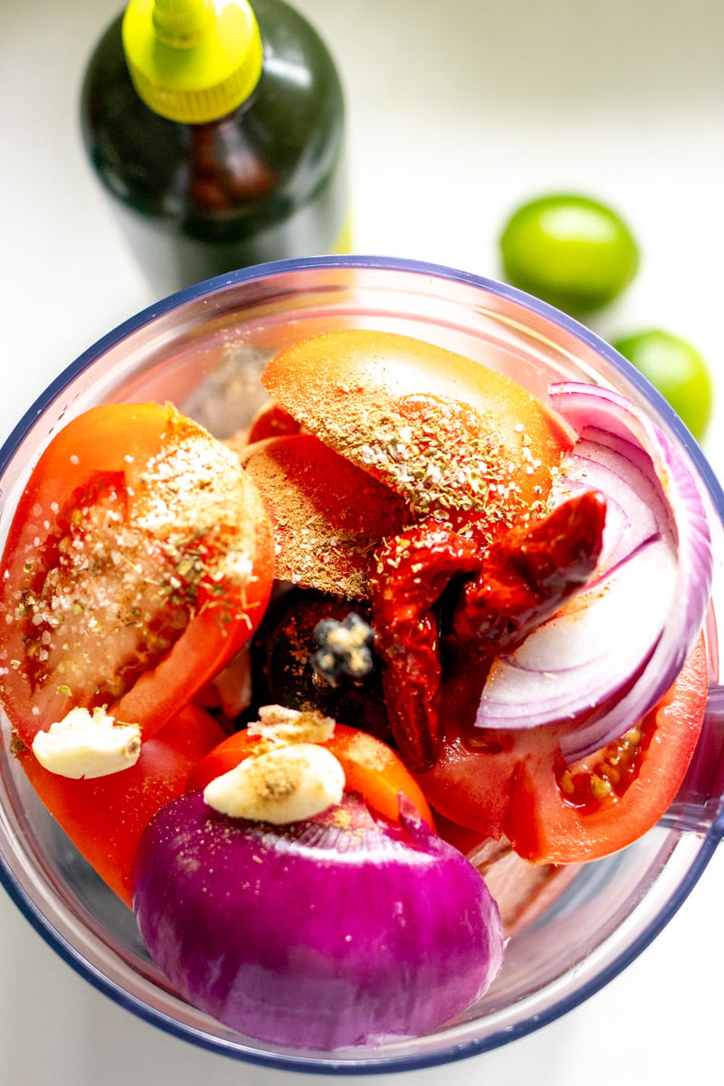 colorful salsa ingredients in a food processor. 