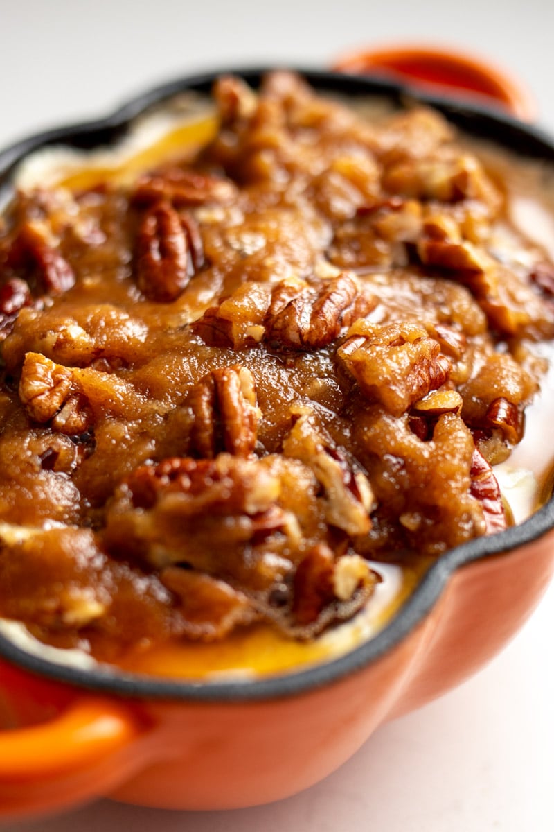 pecan pie inspired goat cheese dip in an orange ramekin.