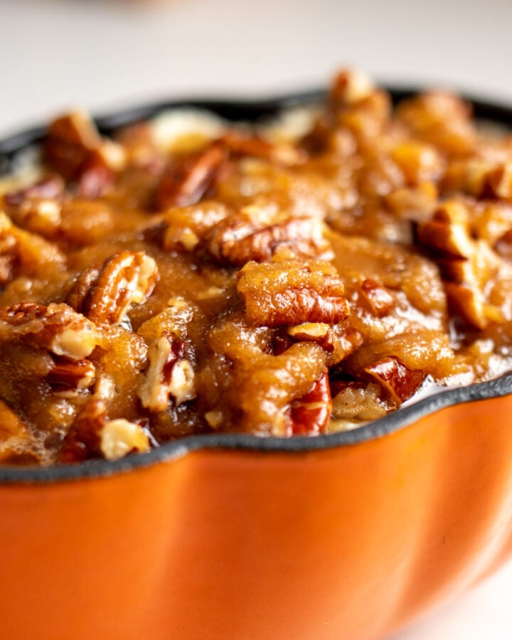 pecan pie inspired goat cheese dip in an orange pumpkin ramekin.