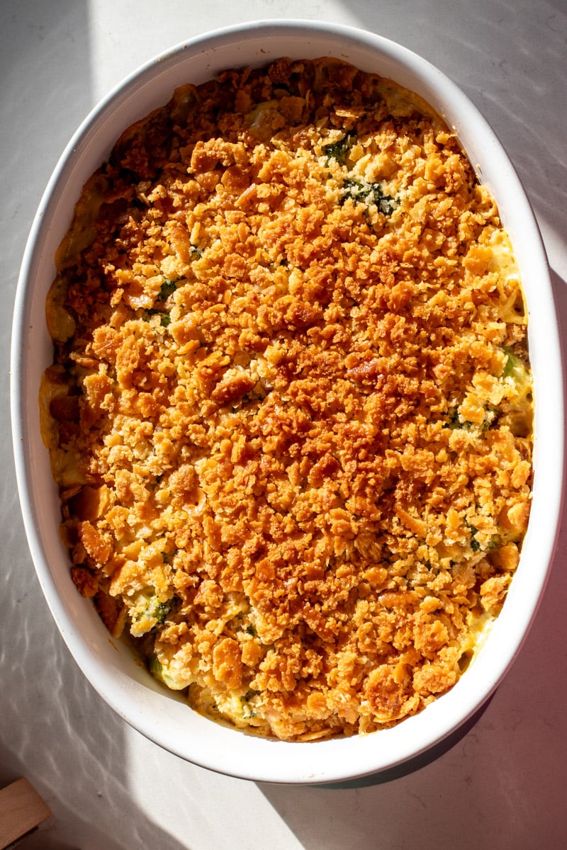 a broccoli cheese casserole fresh out of the oven with a golden crispy crust.