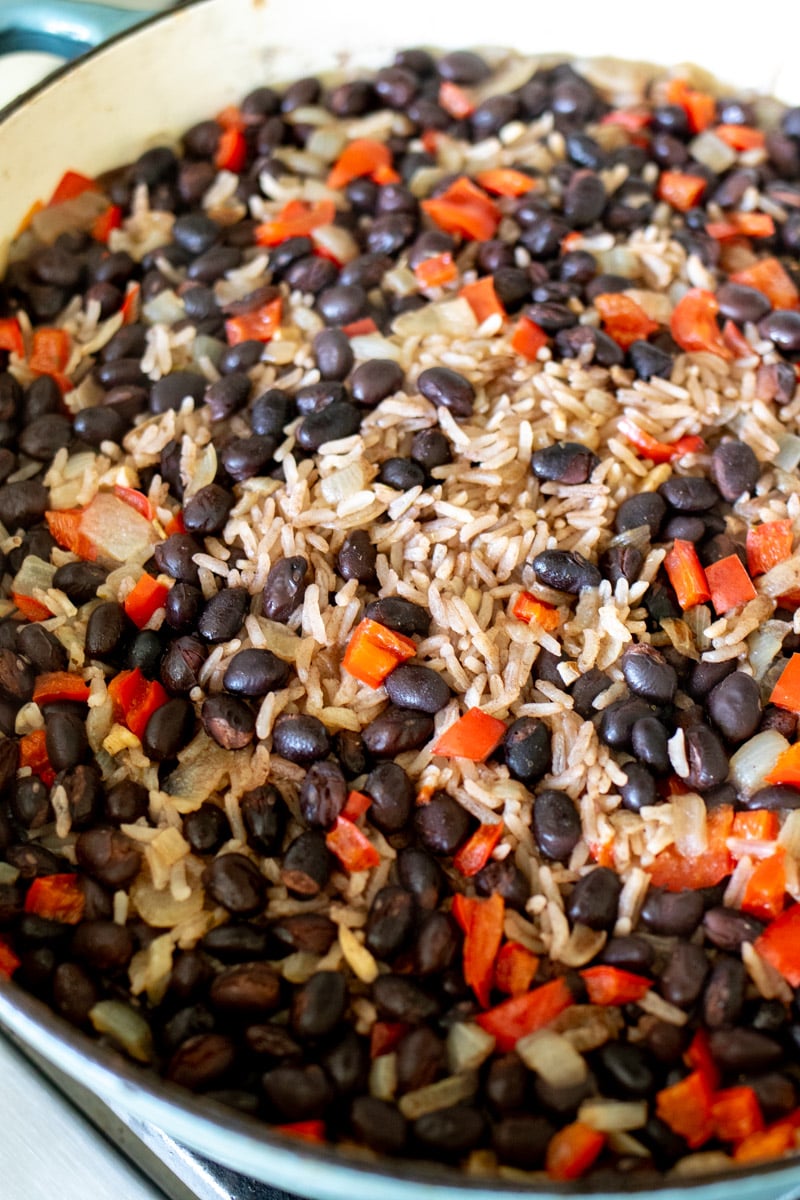 a close up of black beans and rice after the lid comes off.