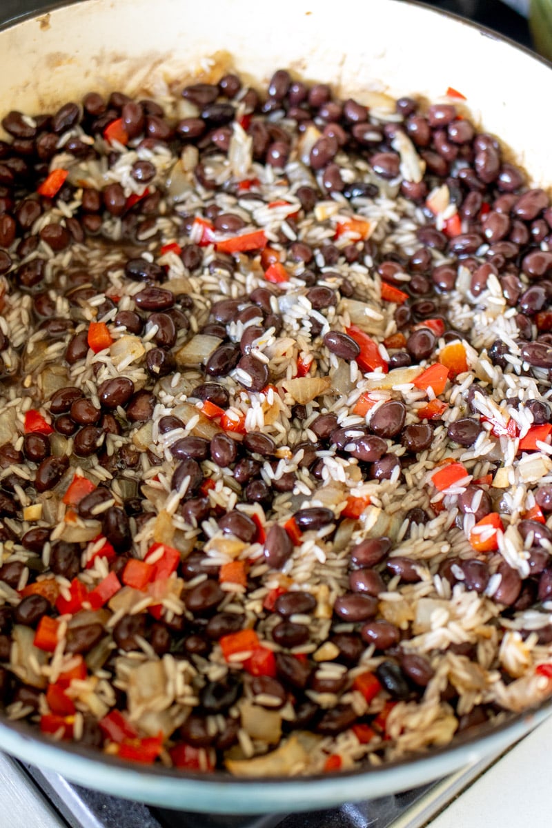 black beans stirred into uncooked white rice.