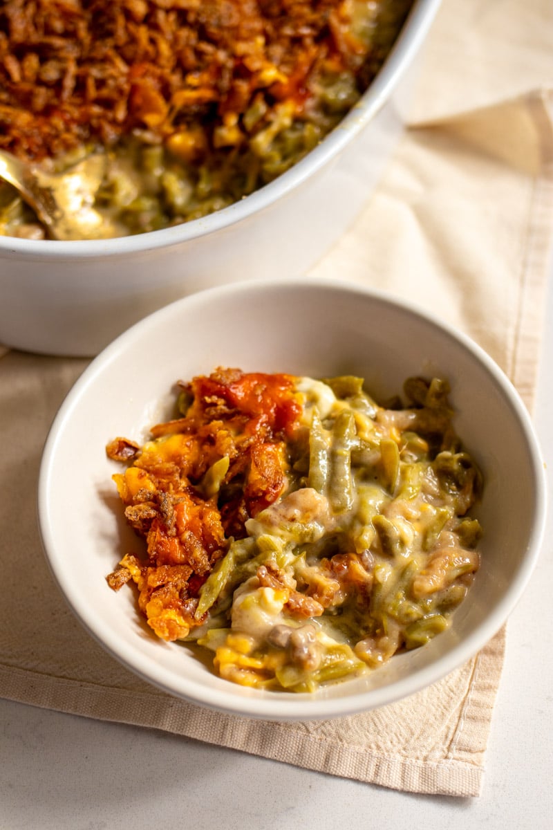 a side dish full of cheesy green bean casserole. 