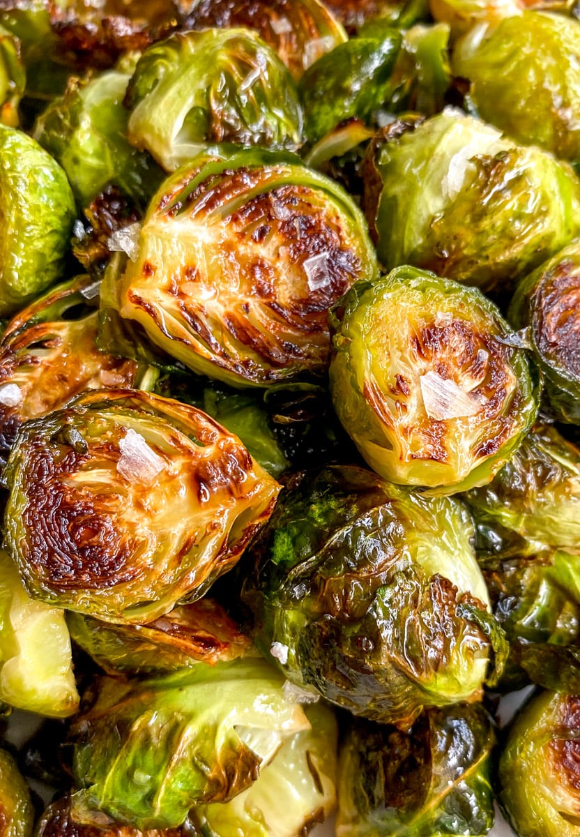 an up close view of the texture of crispy brussels sprouts with a sweet and spicy glaze.