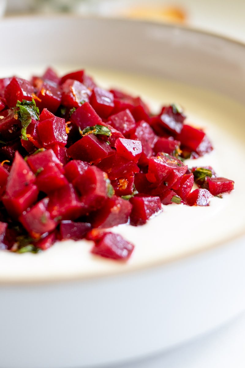 a close up of the hot honey whipped feta and pickled beet salad.