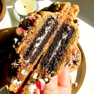 oreo stuffed chocolate chip cookie split in half.