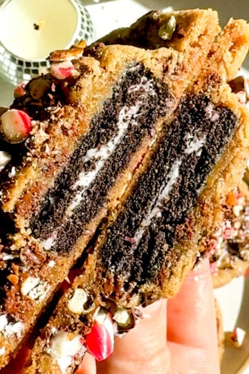 oreo stuffed chocolate chip cookie split in half.