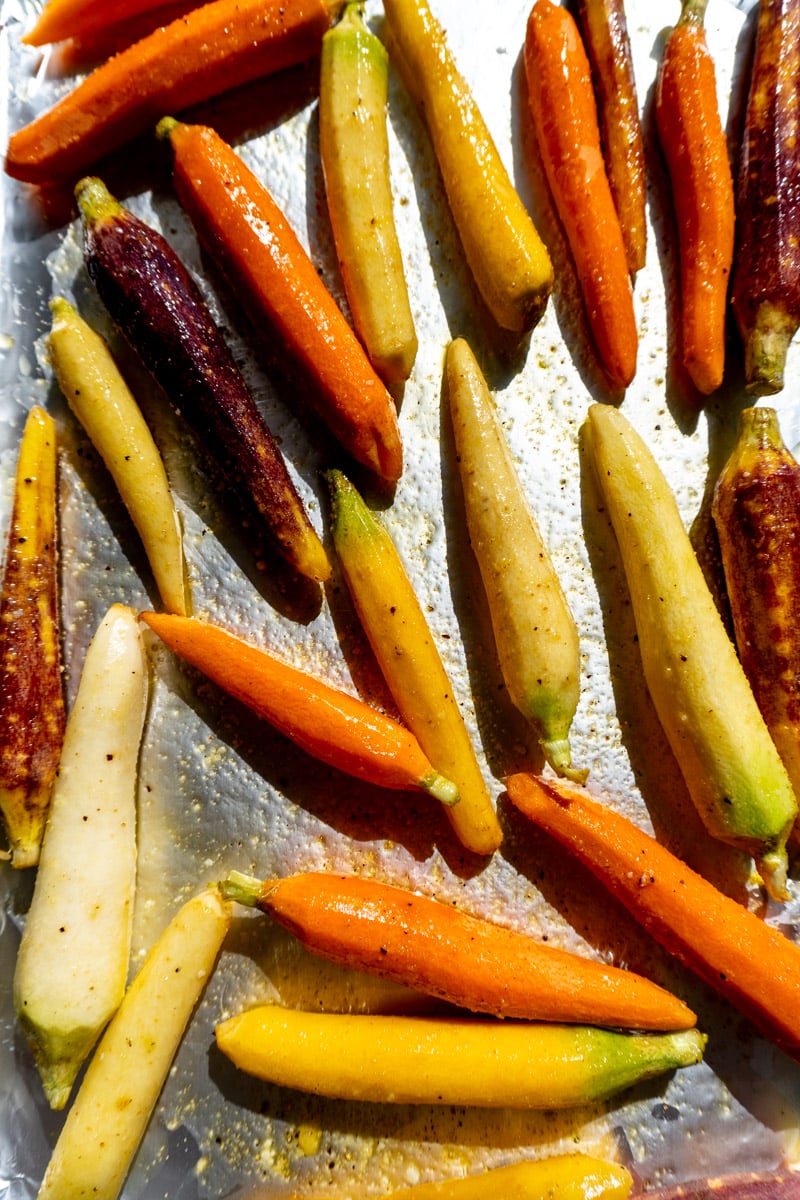 rainbow carrots on a baking sheet.