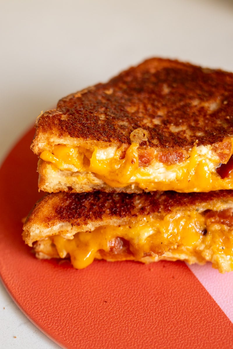 an up close view of the gooey insides of a chicken bacon ranch grilled cheese.