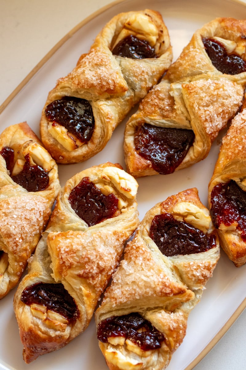 6 cuban guava pastries on a white plate. 