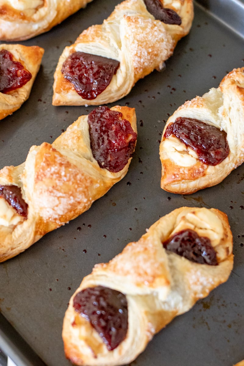 freshly baked guava pastries on a baking sheet.