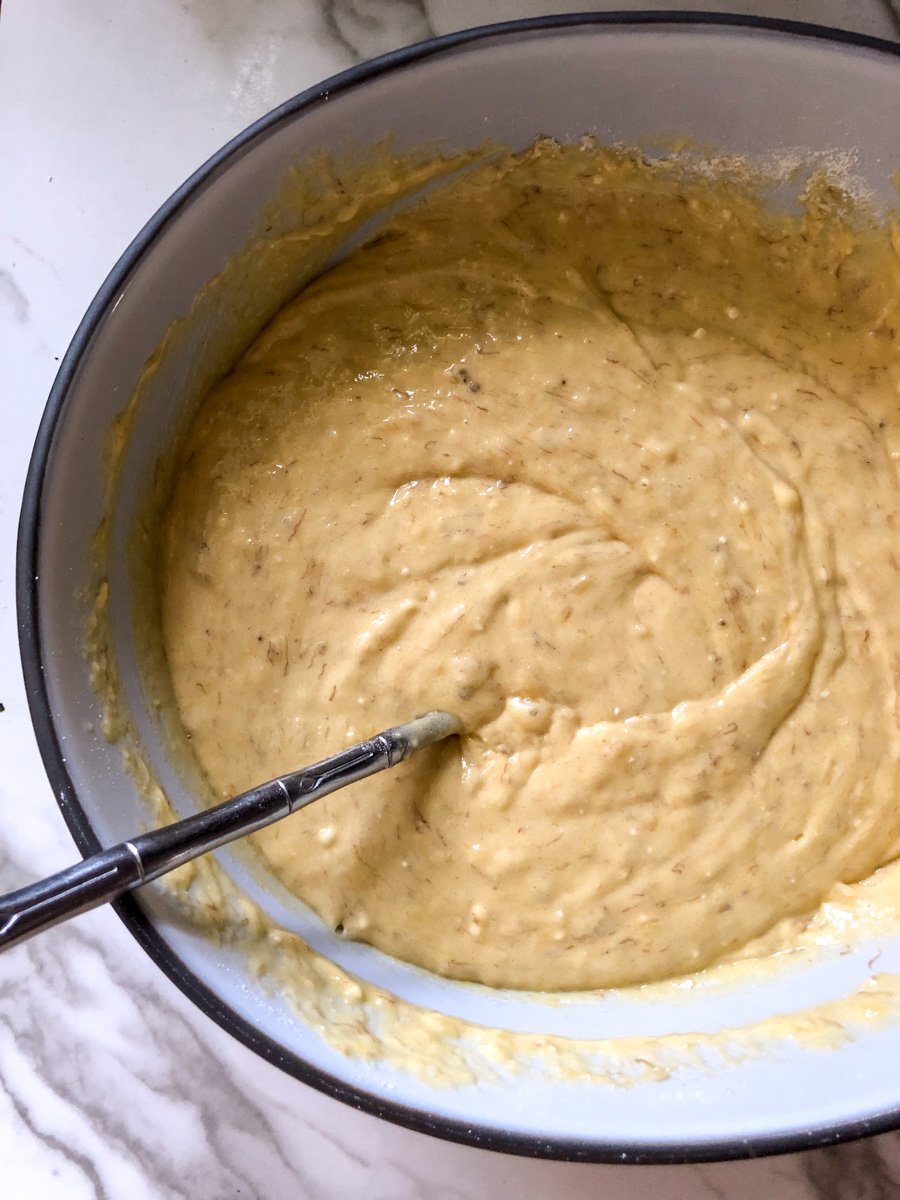 cake mix banana bread batter in a white mixing bowl.