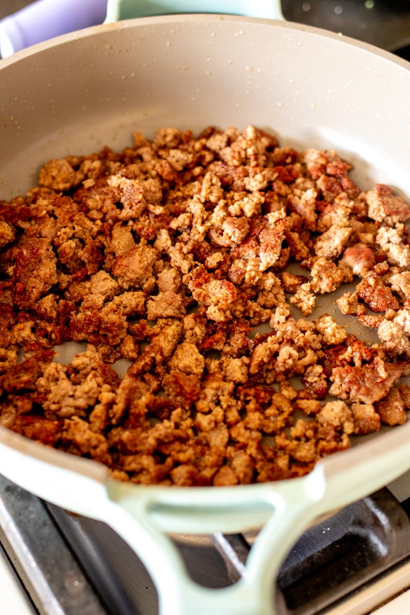 crispy crumbled ground lamb in a frying pan.