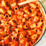 a big pot filled with bright red rigatoni amatriciana