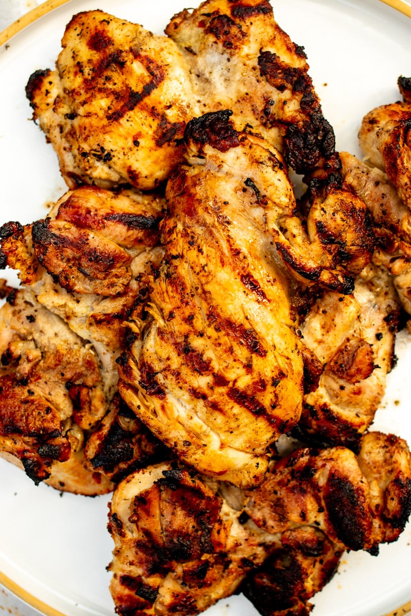 chicken resting on a plate immediately after it was grilled.