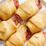 ham and cheese crescent rolls on a baking sheet.