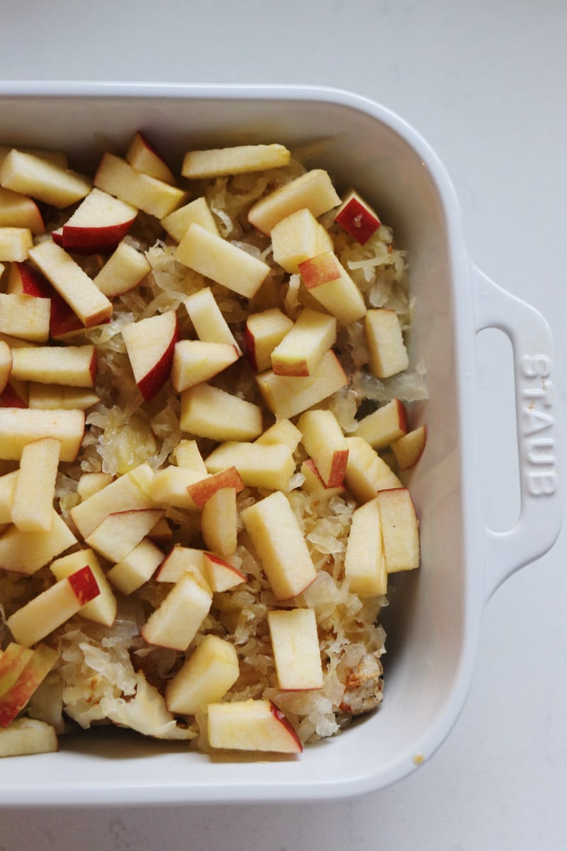 apples on top of sauerkraut and pork. 