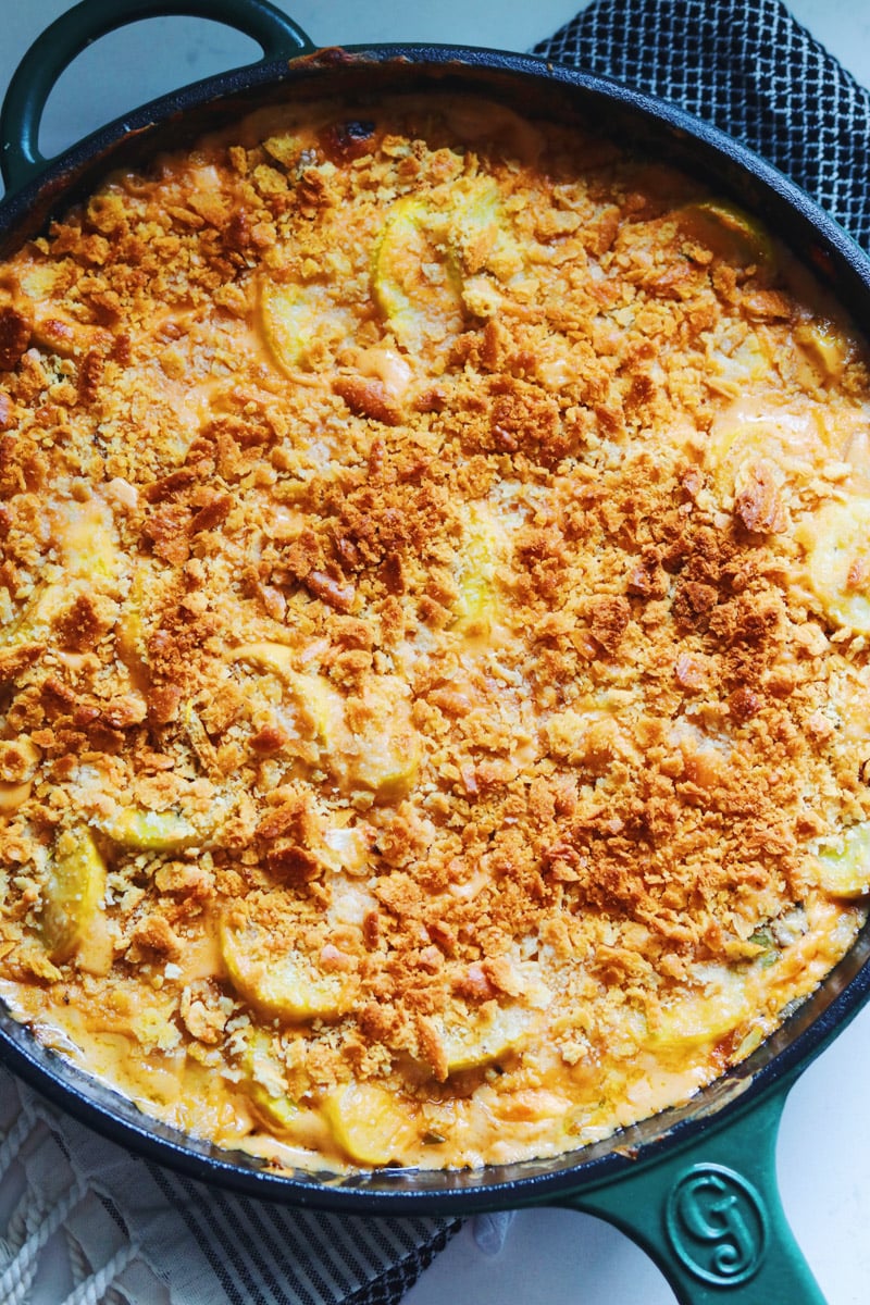 an overhead view of a cheesy squash casserole with crispy ritz cracker crust. 