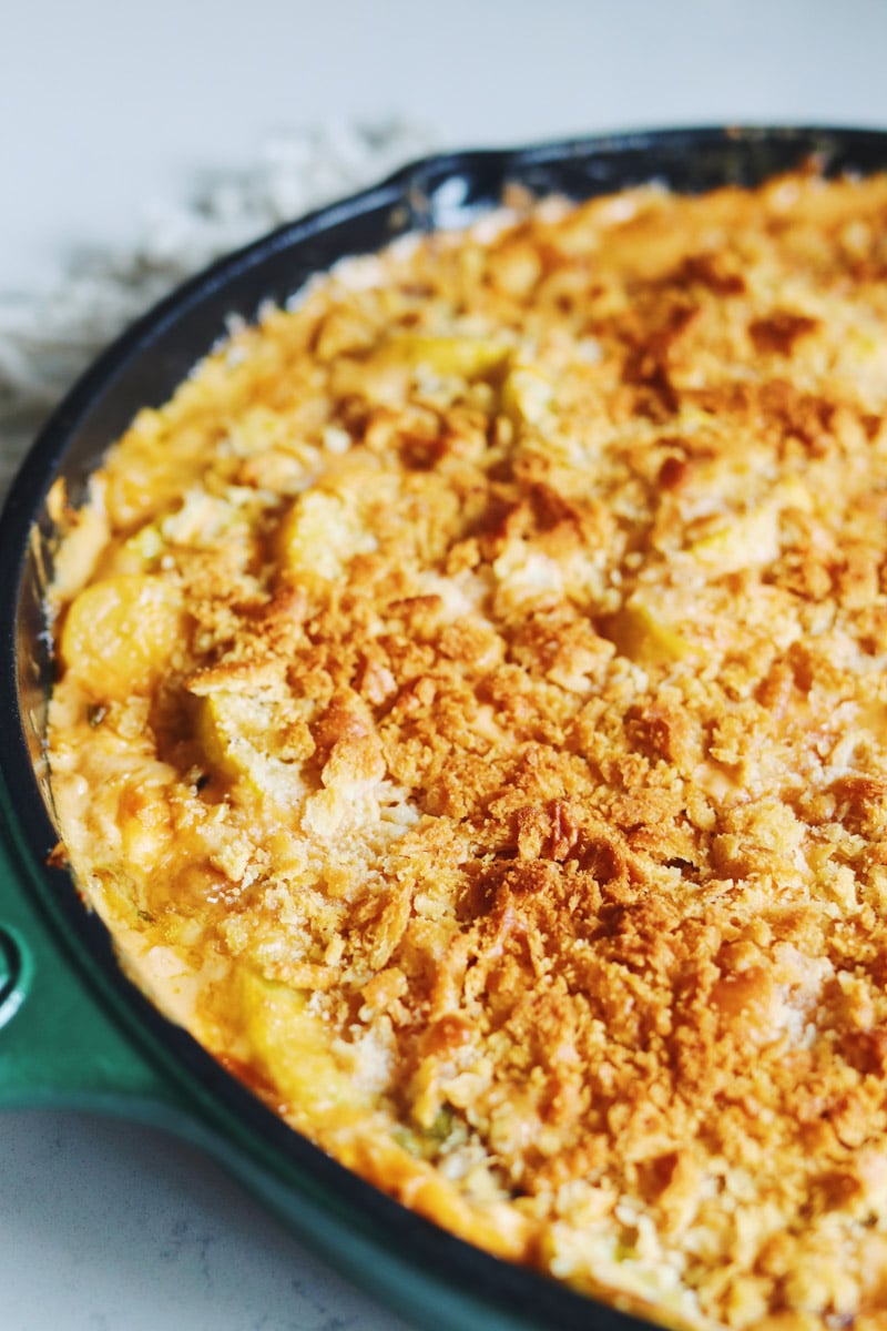 a side view of a squash casserole with a creamy base. 