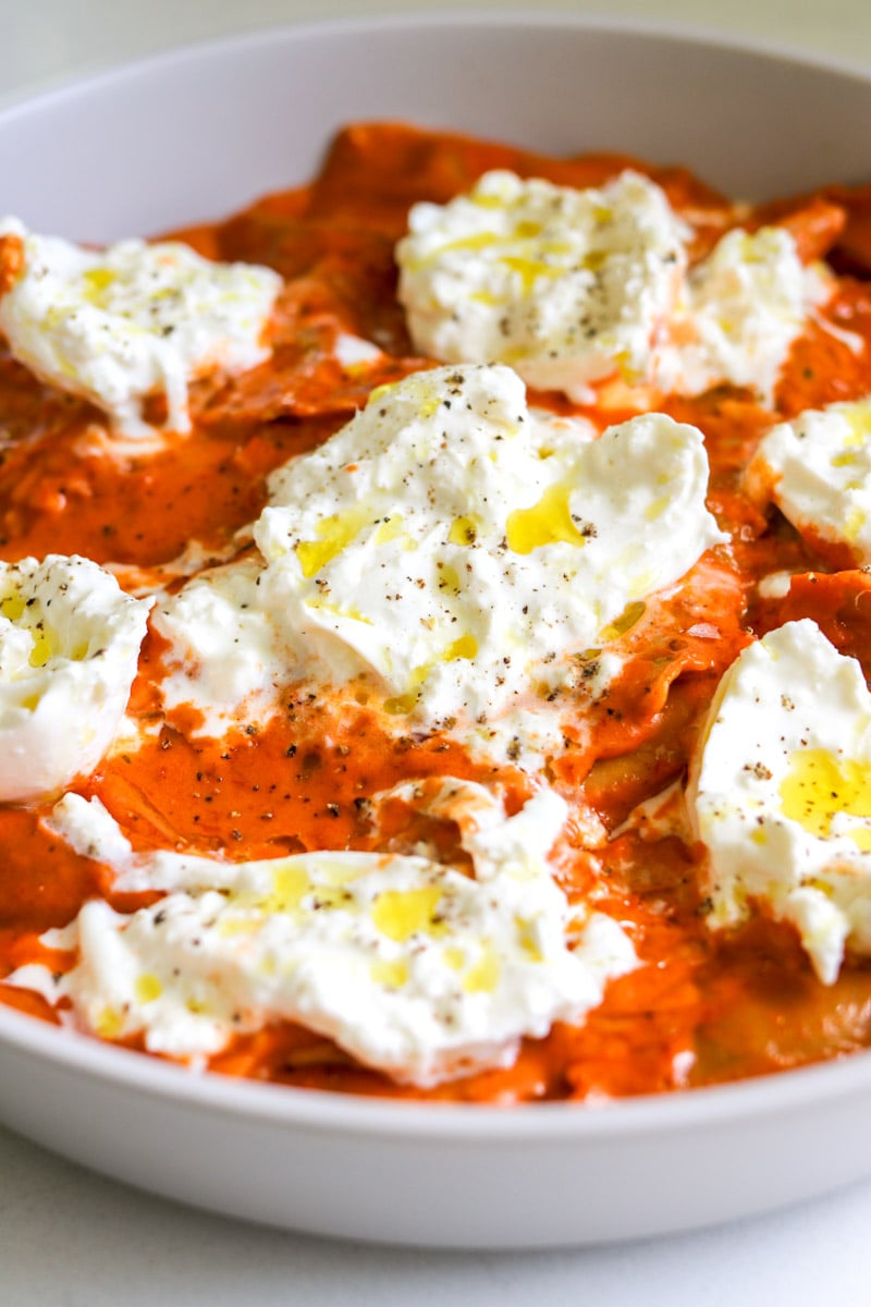 a close up of the texture of this dish featuring trader joes burrata tomato ravioloni and spicy vodka sauce. 