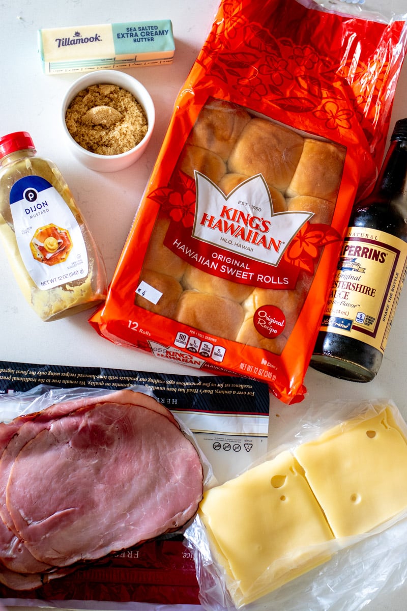 all of the ingredients needed to make funeral sandwiches on a white marble countertop.