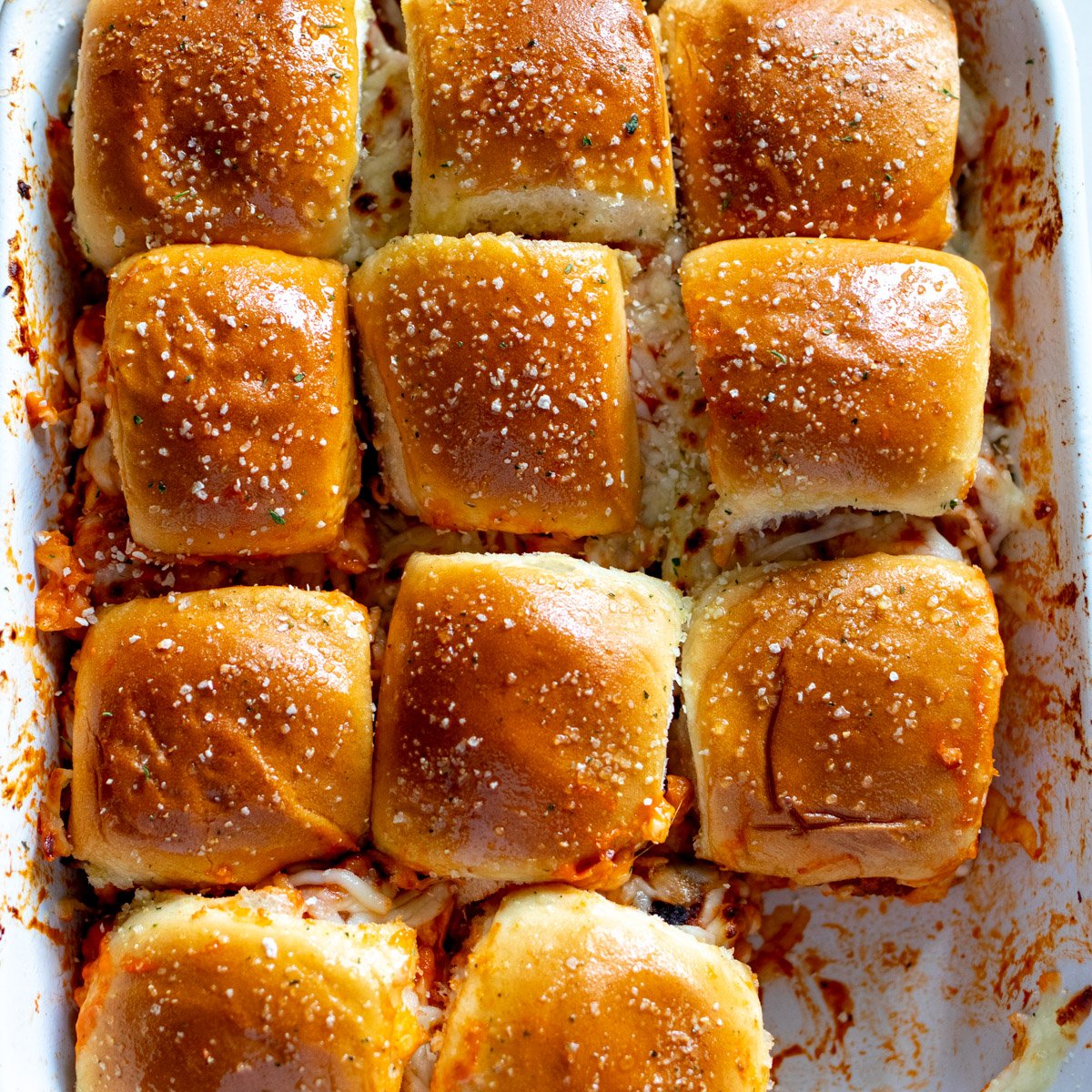 chicken parm sliders in a baking dish.