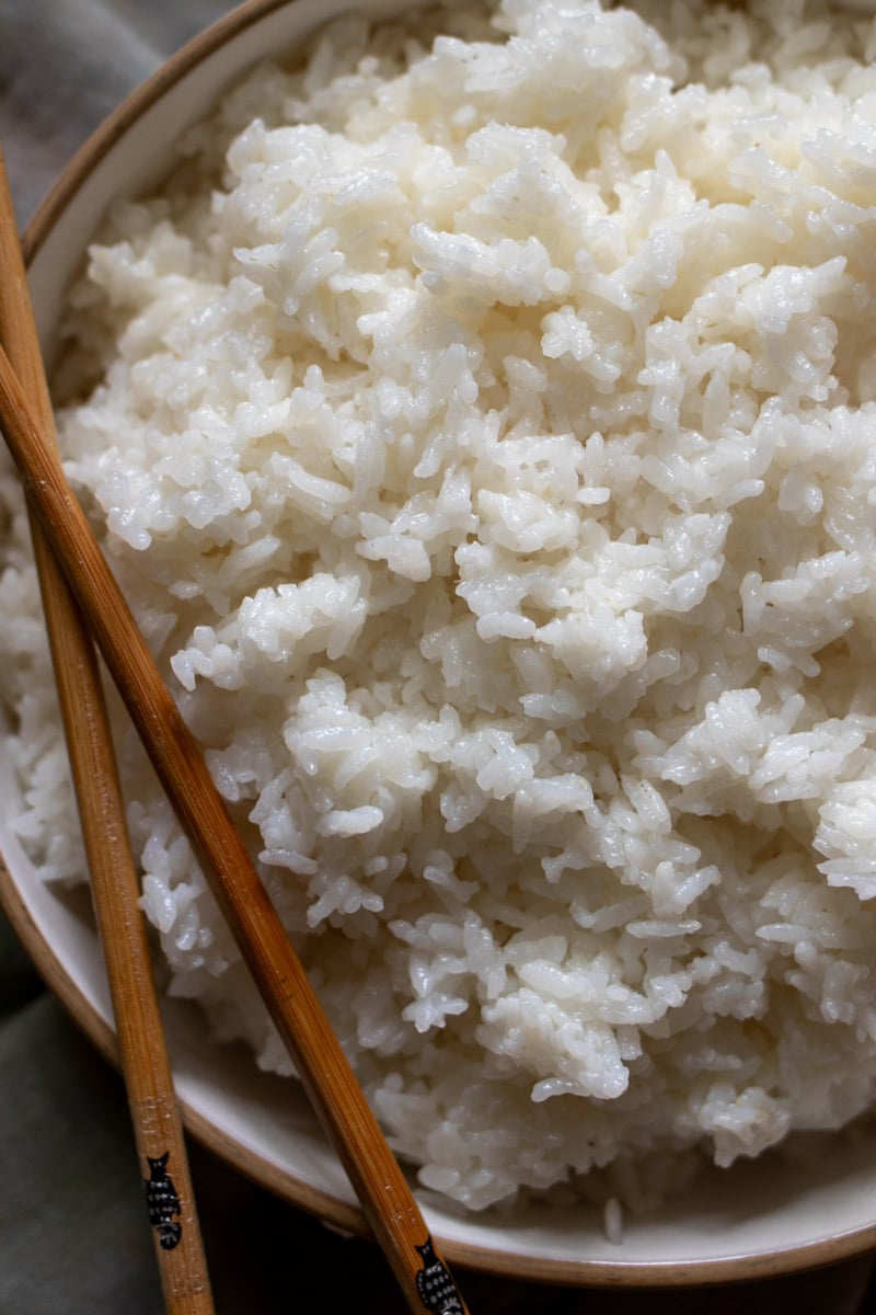 an overhead view of a bowl of white sushi rice.
