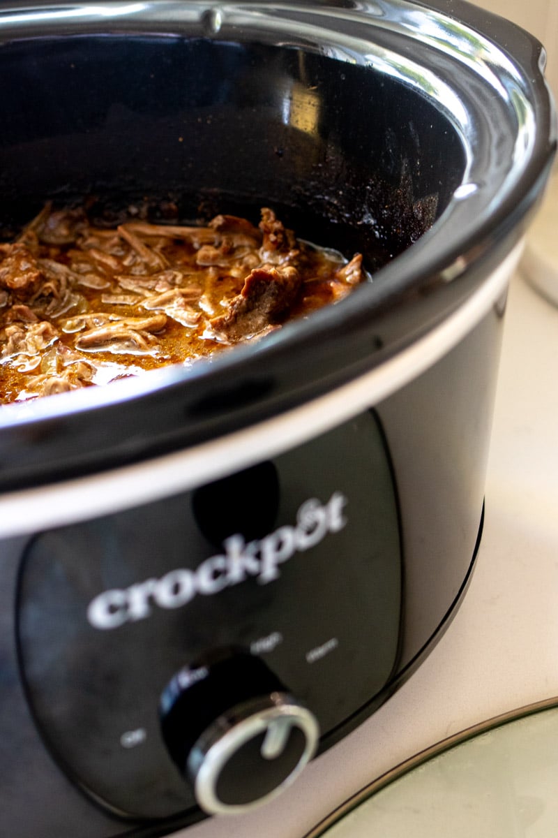 a crockpot full of mexican shredded beef.